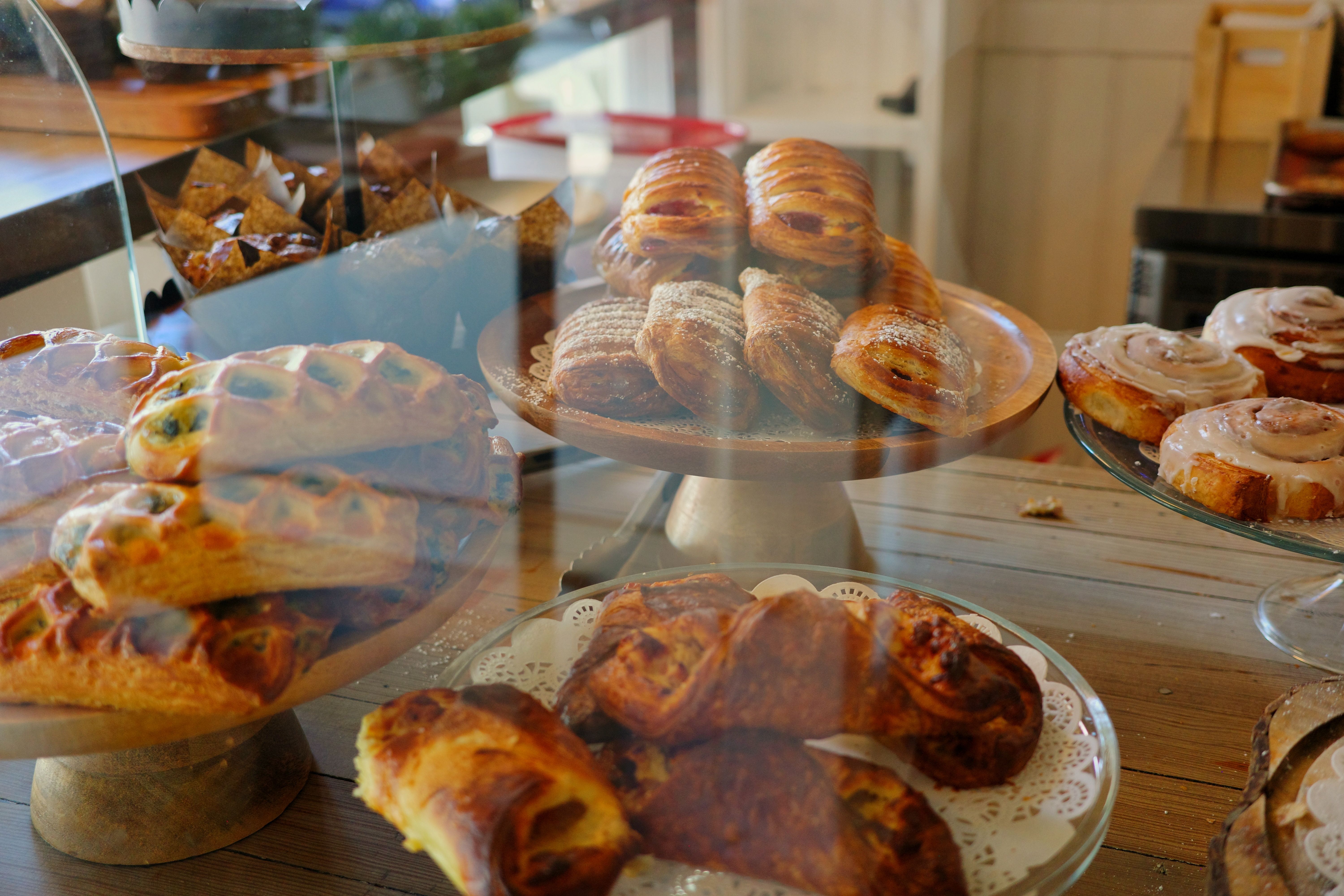Freshly baked golden croissants on a wooden board